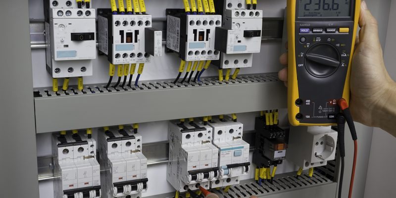 AD Electrics testing an electrical control panel